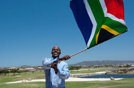 man-waving-south-african-flag man-waving-south-african-flag